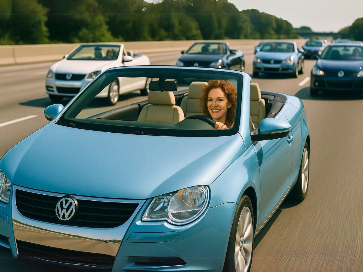 A smiling woman drives a light blue Volkswagen convertible EOS on a sunny highway. Every other car on the road surrounding her is also an EOS.